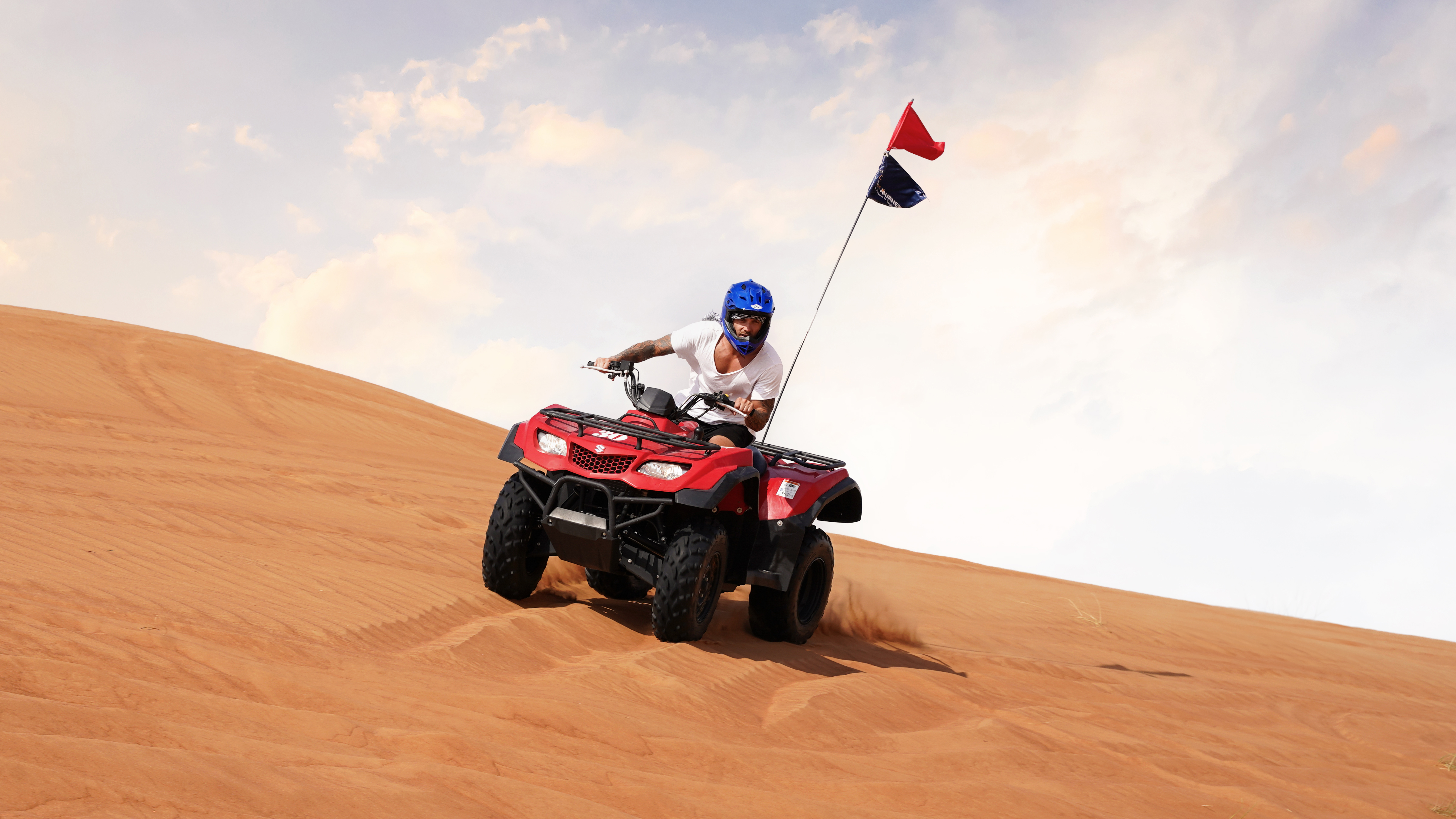 Exciting quad bike ride during small group guided red dune safari with BBQ